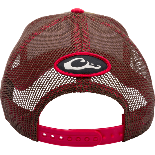 Close-up of Alabama Bottomland Mesh Back Cap with Mossy Oak Bottomland Camo pattern. Structured 6-panel trucker hat with X-Peak visor, embroidered college logo, and snap-back closure.