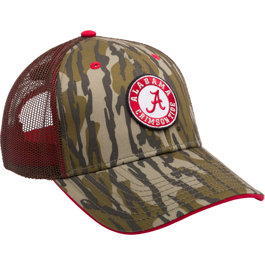 Alabama Bottomland Mesh Back Cap featuring Mossy Oak Bottomland Camo pattern, structured six-panel design with mesh back, X-Peak visor, and 3D embroidered college logo. Snap-back closure for adjustability.