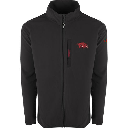 A black jacket with a red logo, featuring Arkansas Full Zip Camp Fleece. Windproof, water-resistant, and ultra-warm fleece material. Stand-up collar, Magnattach™ left chest pocket, and lower handwarmer pockets.