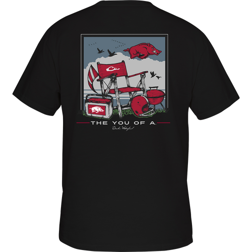 Back of a black t-shirt featuring a pig and a barbecue grill, with a beach scene and school logo. Perfect for game day at the beach.