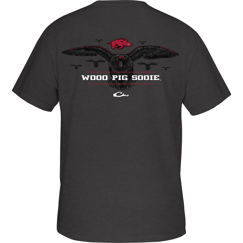 Arkansas Cupped Up T-Shirt: Back artwork of a duck landing, surrounded by other ducks, with school logo and catch phrase. Front features school logo on chest pocket. Cotton/poly blend fabric. Tag-less neck label for comfort.