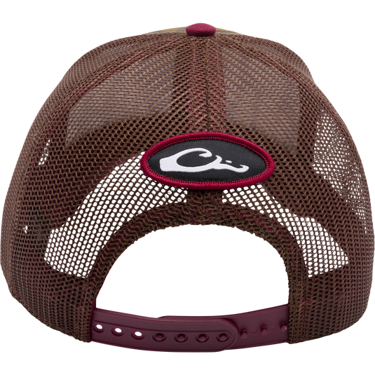 Texas A&M Bottomland Mesh Back Cap, featuring Mossy Oak Bottomland Camo pattern, structured 6-panel design, X-Peak visor, and 3D embroidered college logo. Adjustable snap-back closure for a custom fit.