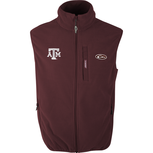 Texas A&M Camp Fleece Vest with logo embroidery. Windproof, water resistant, ultra-warm. Stand-up collar, Magnattach™ pocket, hand warmer pockets.