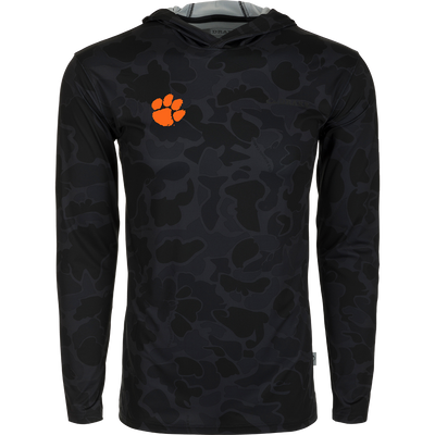 Clemson Performance Long Sleeve Camo Hoodie - A versatile black hoodie with an orange paw print, delivering exceptional functionality with cooling, stretch, and moisture-wicking features. Perfect for all-year wear in various weather conditions.