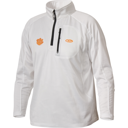 A white Clemson Breathelite™ 1/4 Zip jacket with a zipper on the front chest pocket, featuring the Clemson University Tiger Paw logo embroidery on the right chest. Made of 100% polyester with 4-way stretch and square check fleece backing. Ideal for active outdoorsmen in cool weather.