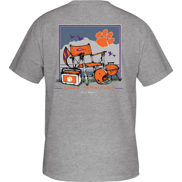 Clemson Beach T-Shirt: Back view of a grey t-shirt with orange and purple designs, featuring a beach scene and school logo. Front showcases school logo on chest pocket.
