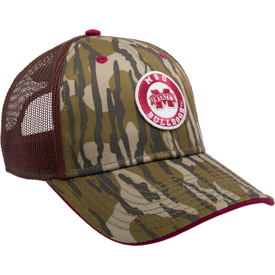 A Mississippi State Bottomland Mesh Back Cap featuring Mossy Oak Bottomland Camo pattern. Structured with poly twill front, mesh back, X-Peak visor, and 3D embroidered college logo. Snap-back closure.