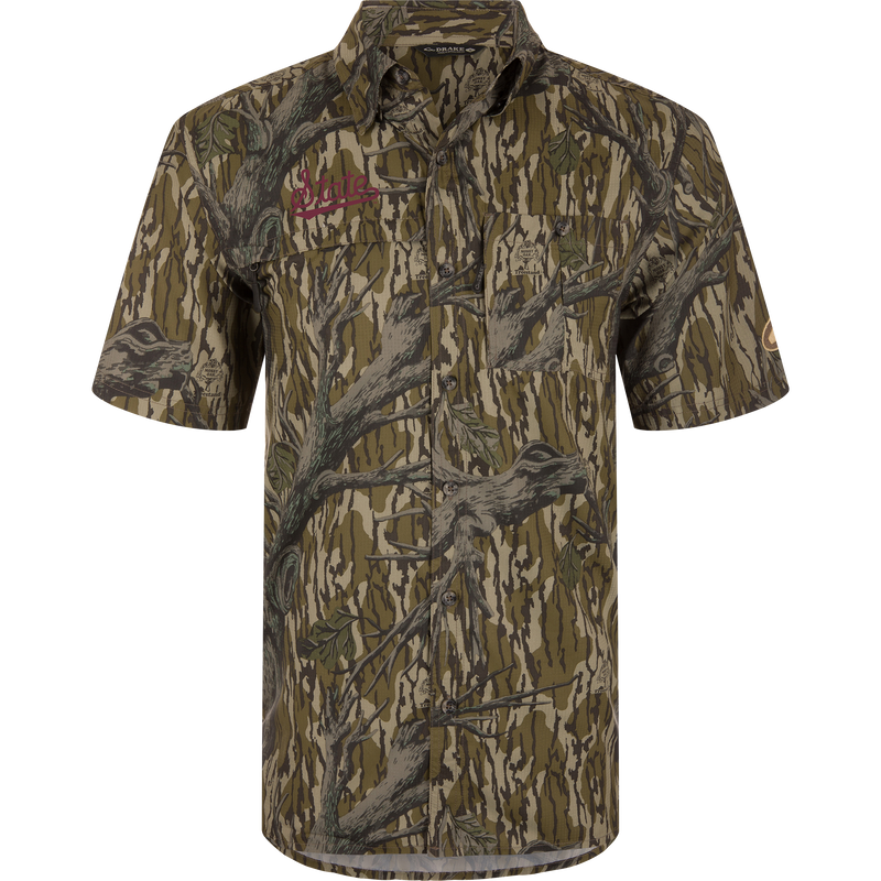 Mississippi State 8-Shot Short Sleeve Shirt with tree-bark camo print, embroidered State logo, chest pockets, and vented cape back, designed for performance and sun protection.