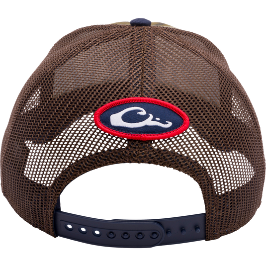 A Ole Miss Bottomland Mesh Back Cap by Drake Waterfowl, featuring Mossy Oak Bottomland Camo pattern, structured crown, mesh panels, X-Peak visor, and 3D embroidered college logo.