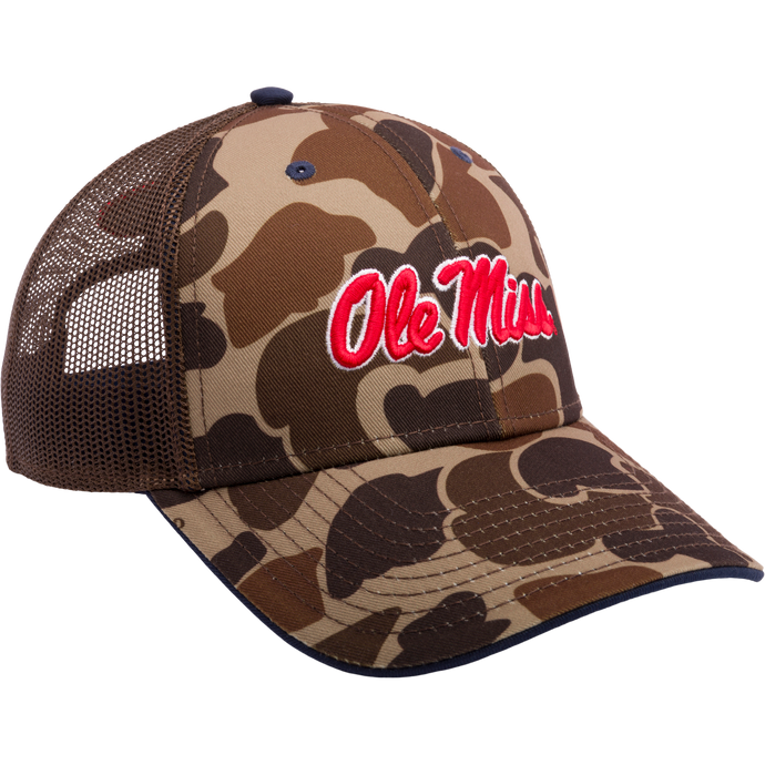 Ole Miss Old School Cap: Camouflage trucker hat with mesh back panels. Features 3D embroidered college logo, structured crown, X-Peak visor, and snap-back closure. Ideal for hunting and casual wear.