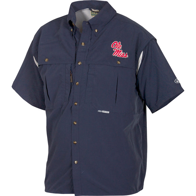 Ole Miss Wingshooter's Shirt Short Sleeve: A blue shirt with a logo, perfect for Game Day. Breathable, cool, and quick-drying. Features front and back ventilation, oversized chest pockets, and a zippered pocket. Made with 100% Polyester twill fabric and Poly-mesh lining in vented areas. From Drake Waterfowl, high-quality hunting gear and clothing.