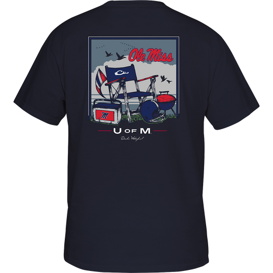 Ole Miss Beach T-Shirt: Back of a t-shirt with a barbecue picture, boat and flag. Chair and helmet on grass, blue and white logo flag, red and white sign with letter M. Red, white, and blue flag. Red text on a blue background. Rectangular box with a letter on it. Blue jacket with a chair and helmet picture. T-shirt with a graphic design.