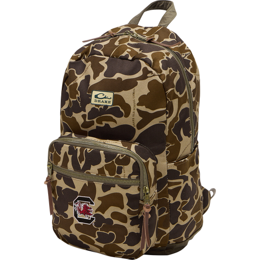 South Carolina Throwback 80 Backpack with camo-print, padded straps, large compartments, and durable cotton canvas, featuring Drake brand patch and Gamecock logo.