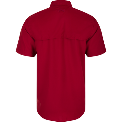 South Carolina Frat Dobby Solid Short Sleeve Shirt, a performance shirt with built-in stretch, UPF 30 sun protection, and moisture-wicking capabilities. Classic fit with hidden button-down collar and vented cape back.