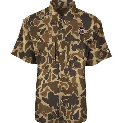 South Carolina S/S Flyweight Wingshooter: A camouflage shirt with a gamecock logo, perfect for warm-weather outdoor activities. Made of ultra-lightweight polyester, it dries quickly and wicks moisture away. Features include UPF 50+ sun protection, vented back, chest pockets, and a vertical zipper pocket.