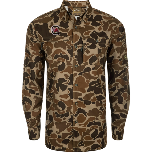 South Carolina 8-Shot Long Sleeve Shirt featuring a camouflage pattern, button-up design, Gamecocks logo, vented cape back, and dual chest pockets with hidden zippers.