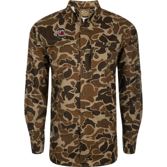 South Carolina 8-Shot Long Sleeve Shirt featuring a camouflage pattern, button-up design, Gamecocks logo, vented cape back, and dual chest pockets with hidden zippers.