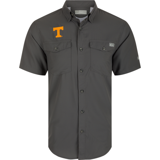 Tennessee Frat Dobby Solid Short Sleeve Shirt: A grey button-up shirt with a logo, hidden button-down collar, and two chest pockets. Made from 100% polyester dobby with UPF30 sun protection and moisture-wicking properties. Classic styling and technical features make it perfect for hunting and outdoor activities.