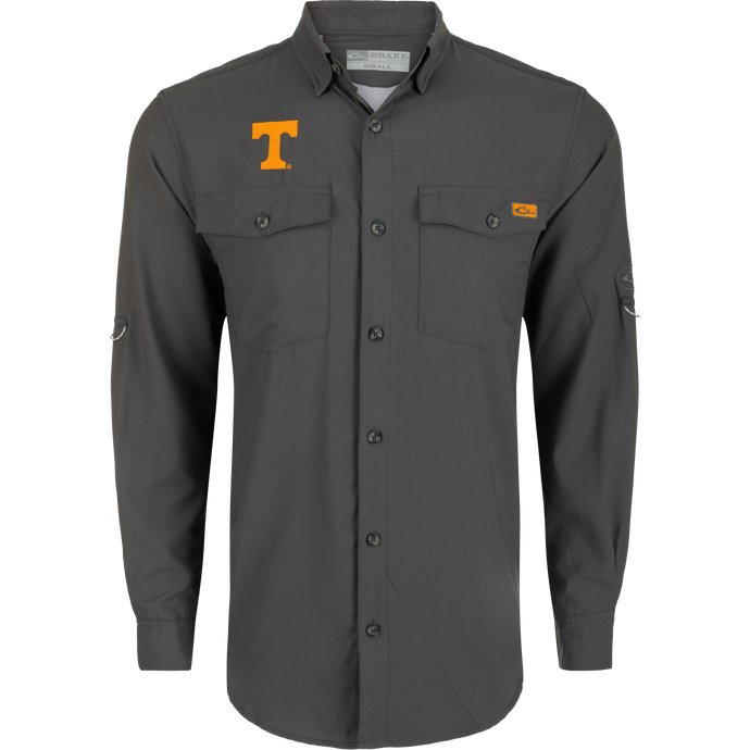 Tennessee Frat Dobby Solid Long Sleeve Shirt: A grey shirt with a yellow T logo, hidden button-down collar, and two chest pockets. Classic style and technical features for outdoor enthusiasts.