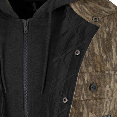 A charcoal gray Spoonie Campfire Hoodie worn under a brown camouflage jacket with quilted lining and snap-button closures.