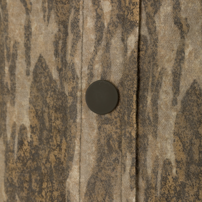 Close-up of a brown camouflage-patterned Spoonie Campfire Hoodie featuring a single dark snap button along the placket.