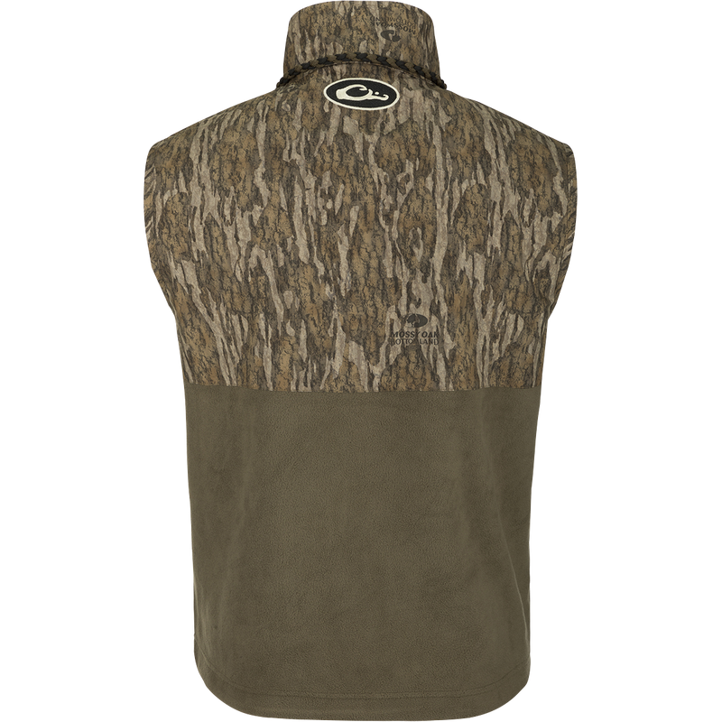 MST Women's Eqwader Vest - A camouflage patterned vest with waterproof protection in the shoulders, fleece-lined upper body, and lower torso made of breathable polyester fleece. Features Magnattach™ and zippered pockets for storage.