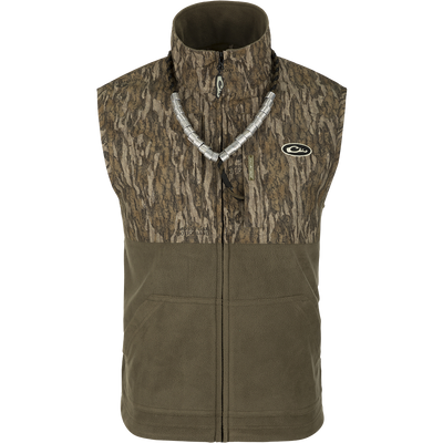 MST Eqwader Vest - A versatile vest with waterproof protection in the shoulders, fleece-lined upper body, and breathable polyester fleece in the lower torso. Features Magnattach™ and zippered pockets for convenient storage. Ideal for hunting and outdoor activities.