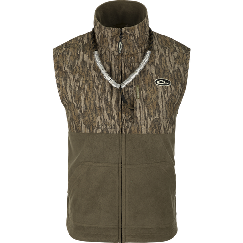 MST Eqwader Vest - A versatile vest with waterproof protection in the shoulders, fleece-lined upper body, and breathable polyester fleece in the lower torso. Features Magnattach™ and zippered pockets for convenient storage. Ideal for hunting and outdoor activities.