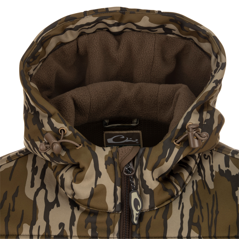 A close-up of the MST Endurance Hoodie With Kangaroo Pouch, featuring a vertical Magnattach™ chest pocket, zippered lower pockets, adjustable fleece-lined hood, and kangaroo pouch.