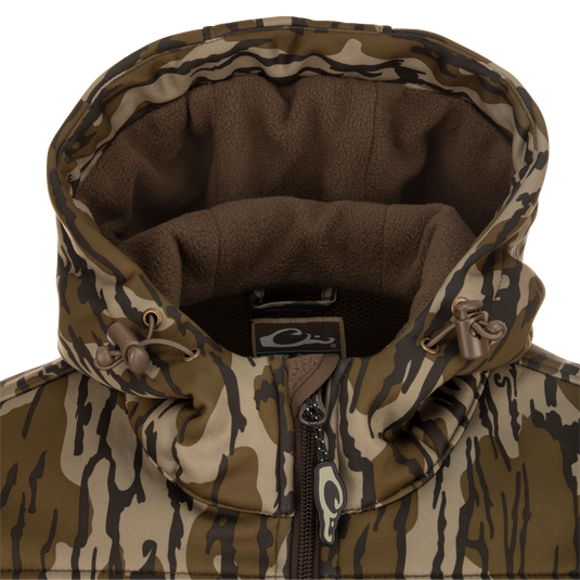 A close-up of the MST Endurance Hoodie With Kangaroo Pouch, featuring a vertical Magnattach™ chest pocket, zippered lower pockets, adjustable fleece-lined hood, and kangaroo pouch.