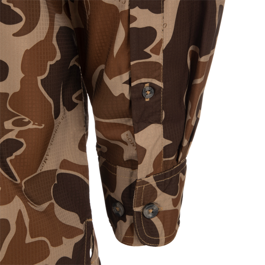A close-up of the Drake 8-Shot Flyweight L/S Shirt, featuring the exclusive Old School Camo pattern. Made from 100% Polyester Dobby fabric, this shirt is lightweight and moisture-wicking. 