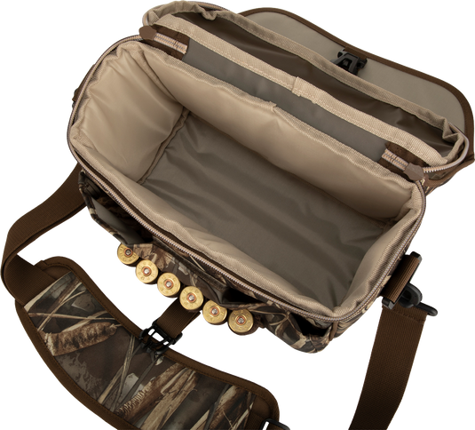 A rugged Refuge Blind Bag by Drake Waterfowl, ideal for daily waterfowl hunting. Features adjustable strap, improved zipper, durable hardware, outer pocket, and neoprene shell loops. Dimensions: 12 W x 8 H x 6 D.