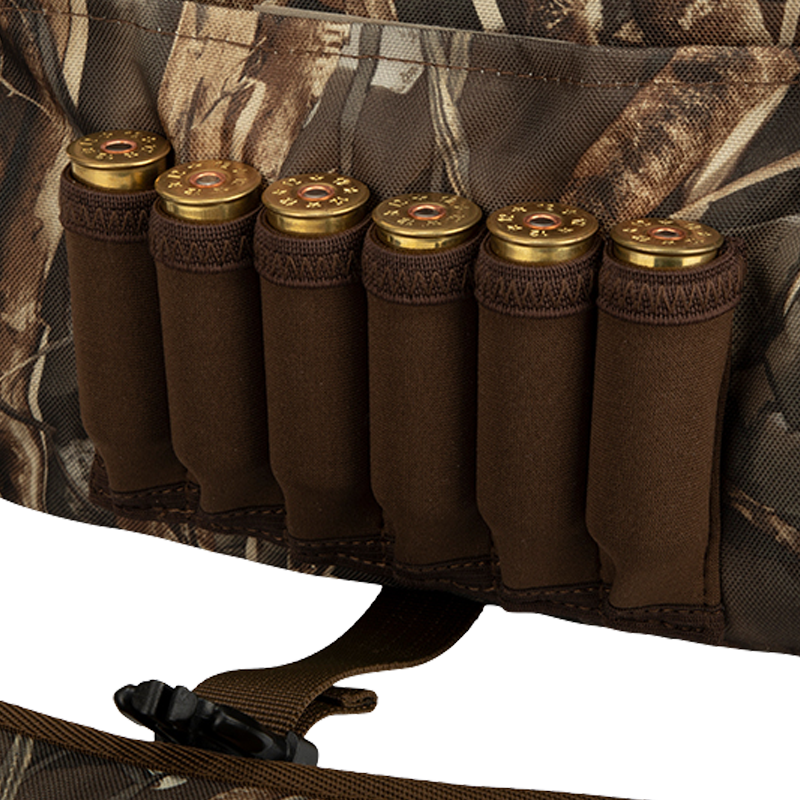 A rugged Refuge Blind Bag by Drake Waterfowl, ideal for waterfowl hunters needing essential gear without excess weight. Features adjustable strap, durable hardware, neoprene shell loops, and waterproof liner.