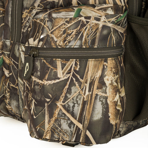 A close-up of the Vertical Zip Daypack, a rugged backpack with optimal storage and accessibility. Features padded shoulder straps, large zippered interior storage, and external carry straps for additional gear. Perfect for hunting, travel, or everyday use.
