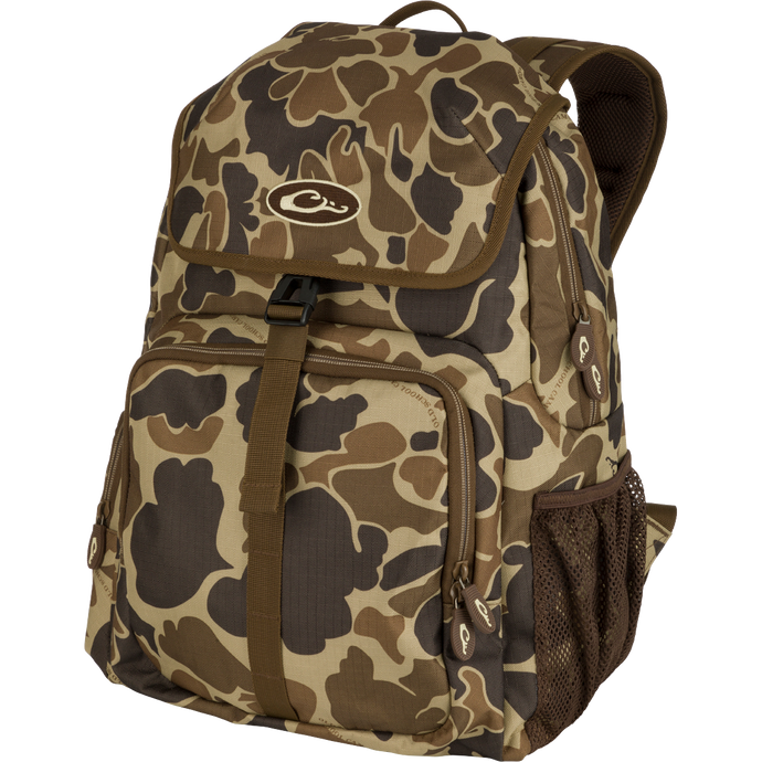 Essentials Daypack: A rugged camouflage backpack with exterior carrying straps, mesh hydration pouch pocket, and adjustable chest strap. Perfect for range, classroom, or field.