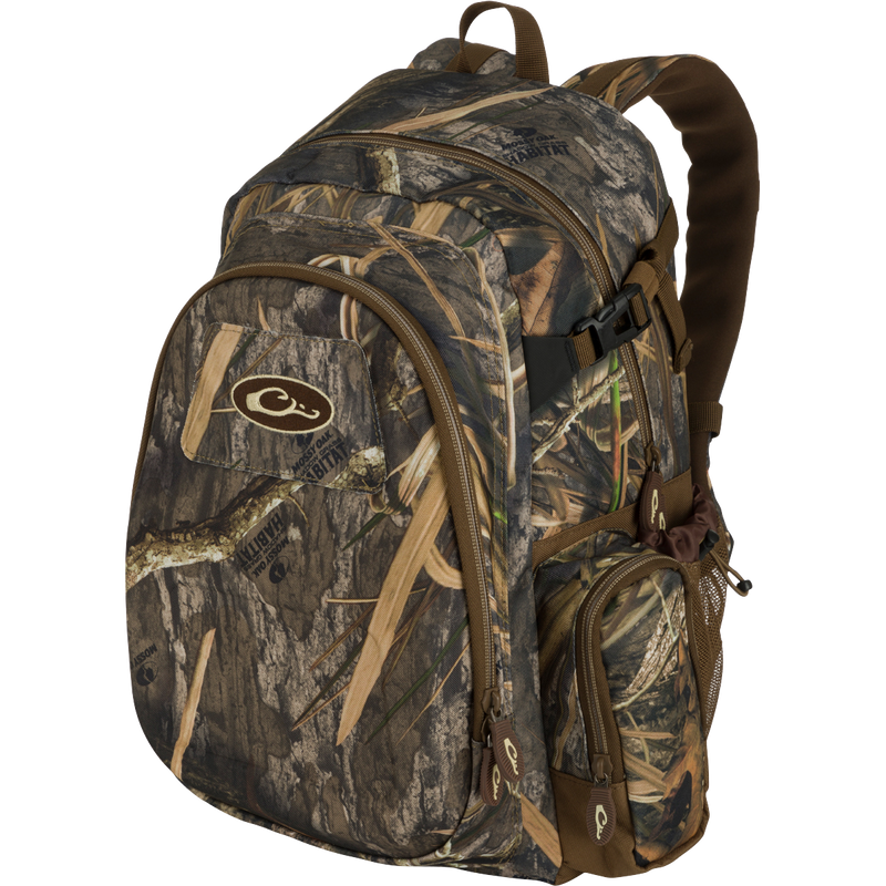 A rugged, PVC-backed Hardshell Every Day Pack with a camouflage pattern. Features a protected outer compartment, sunglasses pouch, and adjustable straps. Ideal for day trips, travel, or everyday use.