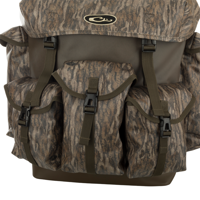 Swamp Pack backpack with PVC-coated polyester upper, waterproof bottom, and EVA molded straps. Roll-top main compartment and 5 outer compartments for organized hunting gear.