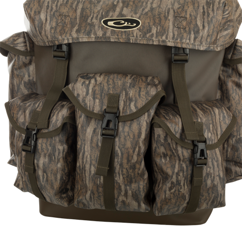 Swamp Pack backpack with PVC-coated polyester upper, waterproof bottom, and EVA molded straps. Roll-top main compartment and 5 outer compartments for organized hunting gear.