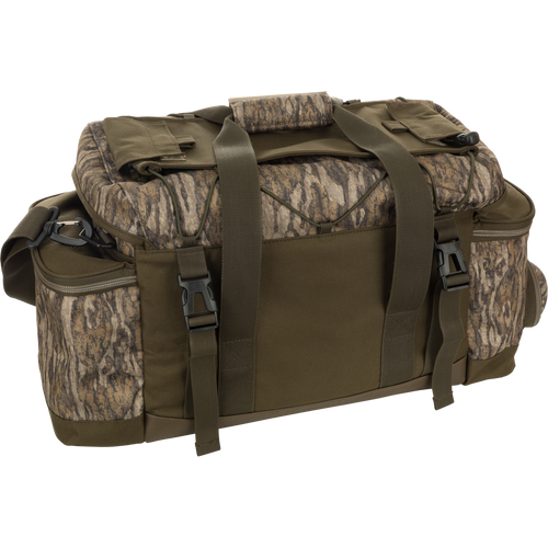 Large Blind Bag with camouflage pattern, straps, and multiple pockets for organized gear storage. Waterproof and durable construction with adjustable shoulder strap. Ideal for hunting and outdoor activities.