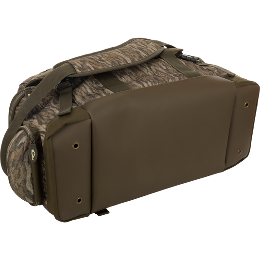 Large Blind Bag: A camouflage bag with straps, featuring 18 pockets for organizing gear. Waterproof, durable, and abrasion-resistant. Adjustable shoulder strap. Dimensions: 18"L x 11"H x 10"D. From Drake Waterfowl, a store specializing in high-quality hunting gear and clothing.