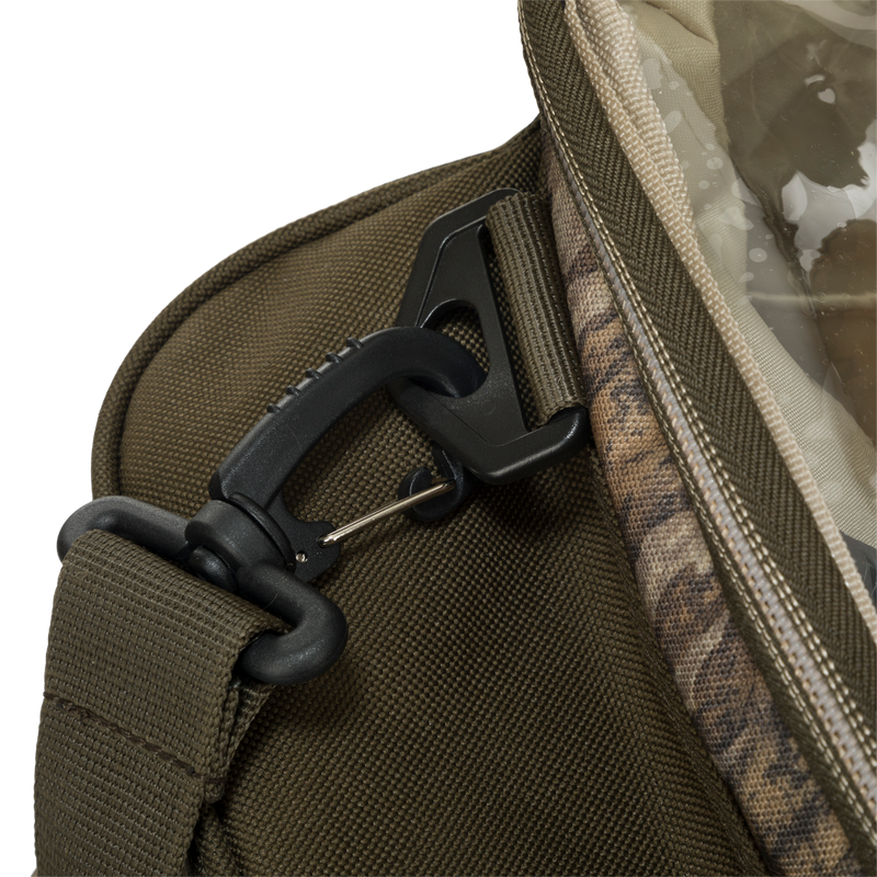 A close up of the Large Blind Bag by Drake Waterfowl. Loaded with 18 pockets for organizing gear, featuring a waterproof internal compartment and heavy-duty bottom for durability. Adjustable shoulder strap and dimensions of 18