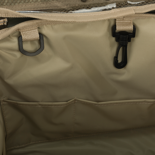 A close-up of the Large Blind Bag by Drake Waterfowl, featuring 18 pockets for organizing gear. Waterproof construction with durable nylon/TPU bottom. Improved thermos/jacket sleeve and adjustable shoulder strap. Dimensions: 18