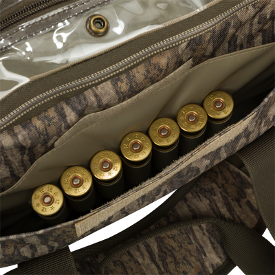 Large Blind Bag with cartridges, gold object, and bullet casings. Waterproof, durable, and organized with 18 pockets. Perfect for hunting gear and accessories.