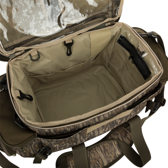 Large Blind Bag with clear inside, waterproof compartments, and adjustable strap. 18 pockets for organized gear storage. Durable and waterproof materials. Ideal for hunting and outdoor activities.