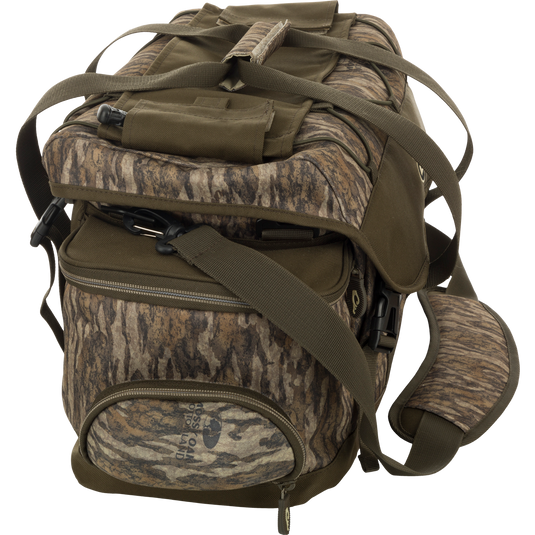 A large blind bag with multiple pockets and adjustable strap for organizing hunting gear. Waterproof and durable construction.