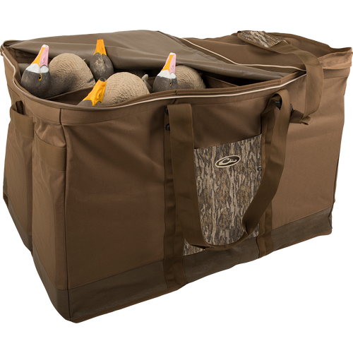 A rugged 6 Slot Zippered-Top Decoy Bag with duck decoys inside. Carry all your decoys in one bag with padded shoulder strap and integrated pocket.
