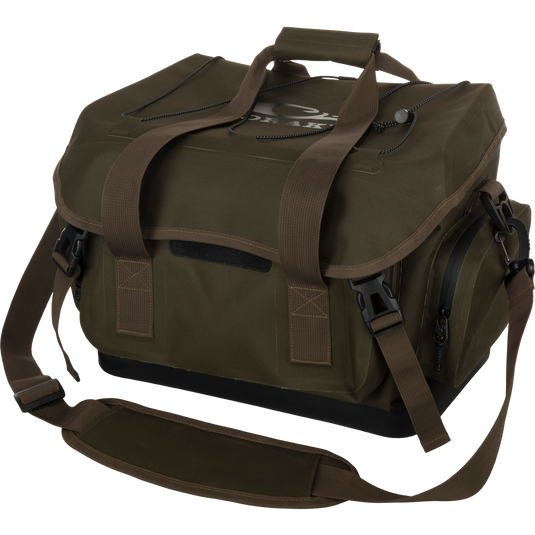 HND Blind Bag: Waterproof green bag with straps. Features large storage area, exterior pockets with waterproof zippers, and customizable organization. Perfect for hunting and outdoor activities.