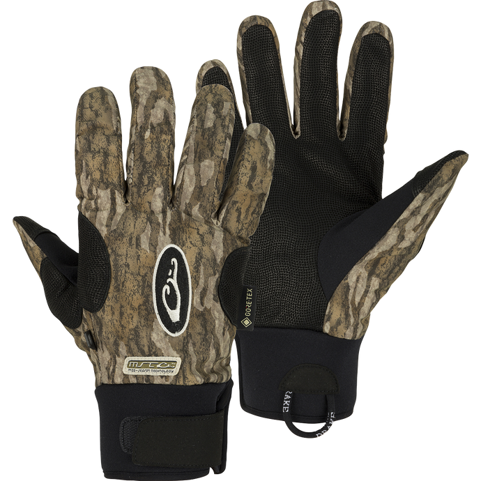 MST Refuge HS GORE-TEX Gloves: A close-up of gloves with a logo and a bag, designed for in-between seasons. Waterproof/breathable protection for effective field use.