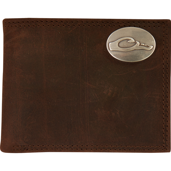 A Leather Bi-Fold Wallet featuring a brown full grain leather exterior and a silver oval Drake logo.