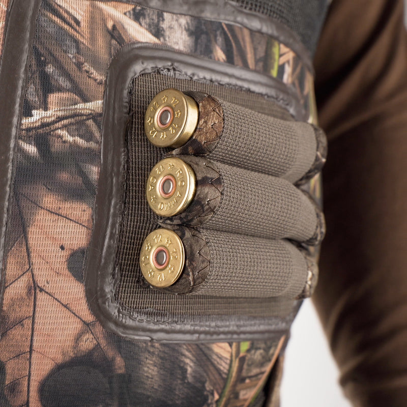 A close-up of the Buckshot Eqwader 1600 Neoprene Wader 3.0, showcasing the vest, bullet casings, and bullet.